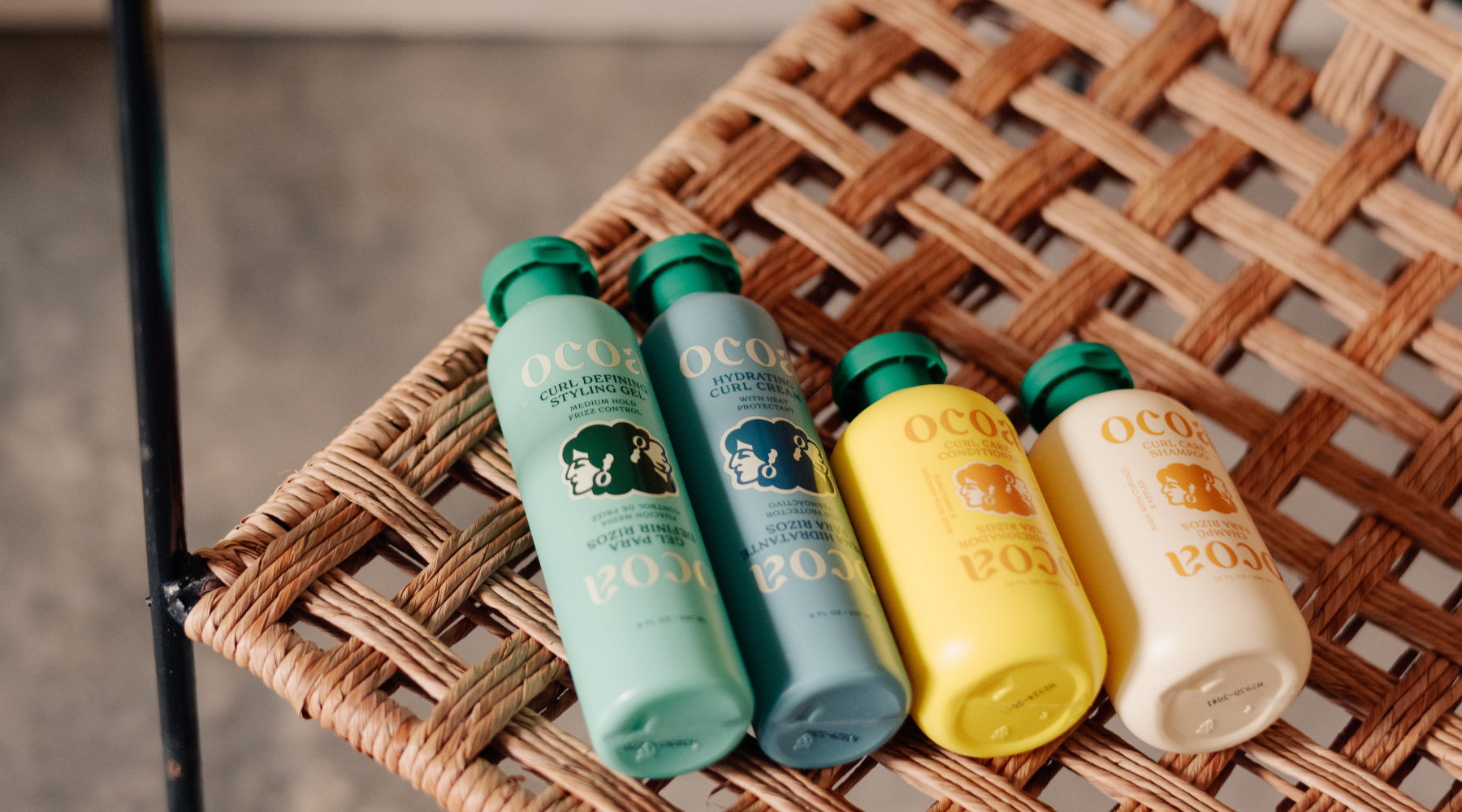 OCOA 4-step kit: curl gel, curl cream, curl care conditioner and curl care shampoo on a chair