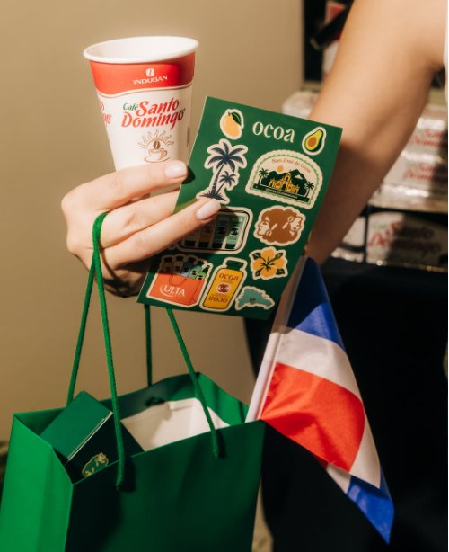 Ocoa sticker sheet, a Santo Domingo coffee cup and a Dominican flag